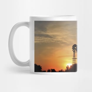 Kansas colorful Sunset with a Windmill silhouette and a bird in the sky. Mug